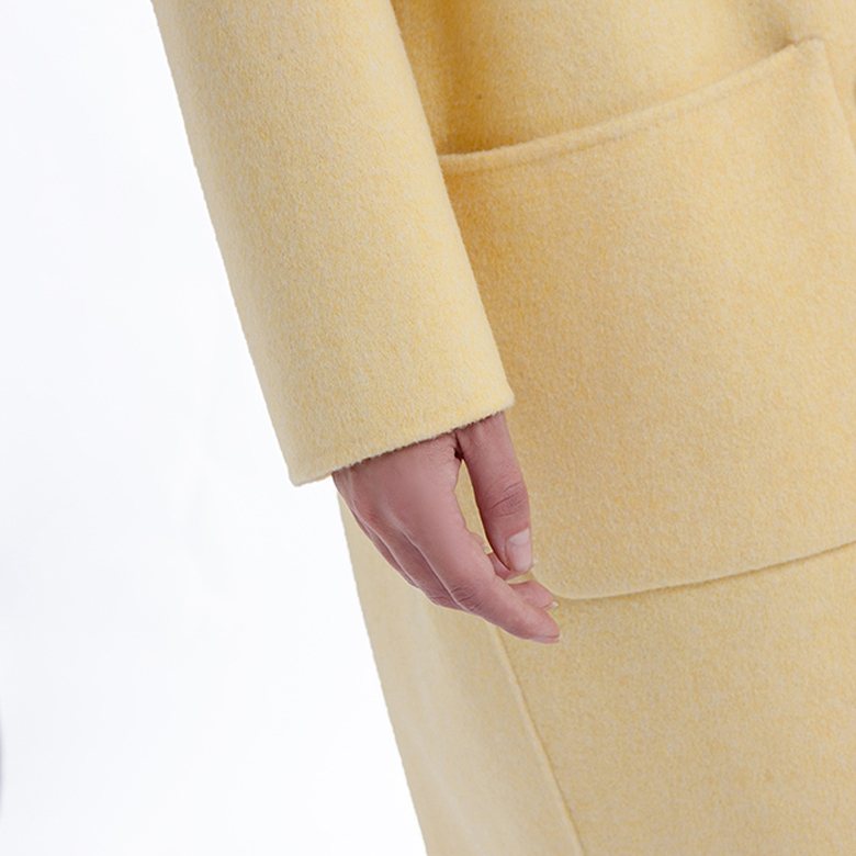 Sleeves of a new yellow cashmere blended overcoat