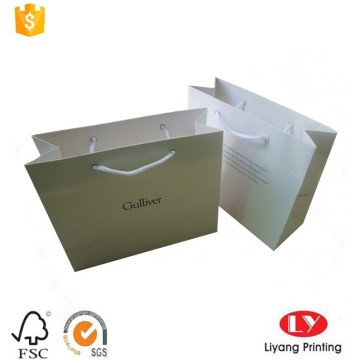 Luxury white paper shopping bag with handle