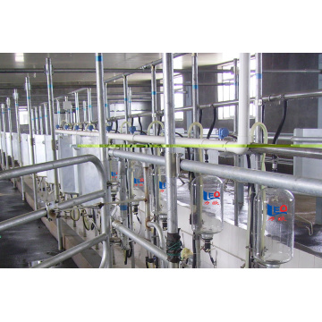 Automatic mid-set milking parlor