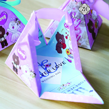Pyramidal wedding candy gift paper box with ribbon