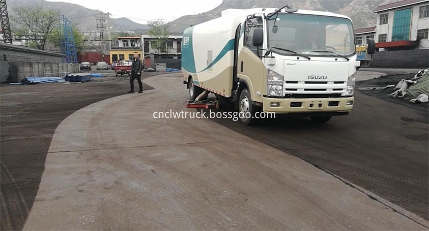 road sweep truck works in coal yard