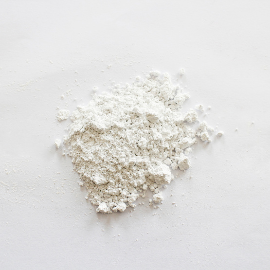 Environmentally friendly calcium carbonate carrier additives