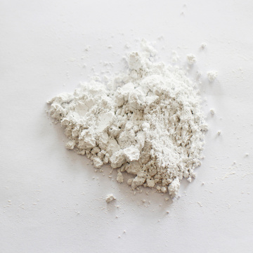 High whiteness calcium carbonate carrier additive