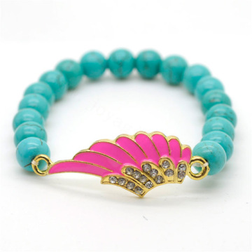 Turquoise 8MM Round Beads Stretch Gemstone Bracelet with Diamante alloy Wing Piece