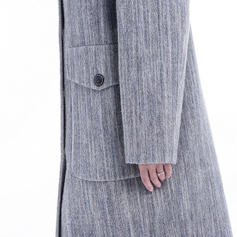 Pocket of lady's grey classic cashmere overcoat