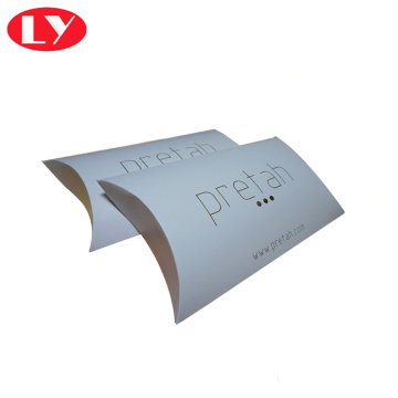 White paper pillow box with gold foil logo