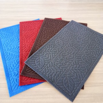 Nonwoven polyester velour pile embossed mat