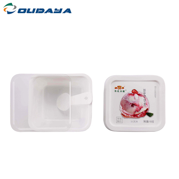 square yogurt cup with lid and spoon