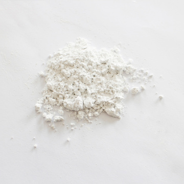 Non-corrosive calcium carbonate carrier additive