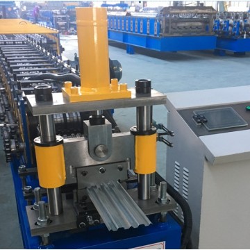 Roll forming machine for standing seam roof panels