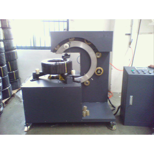 Wire rod coil ring wrapping machine