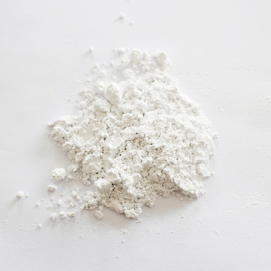 Odorless calcium carbonate carrier additive