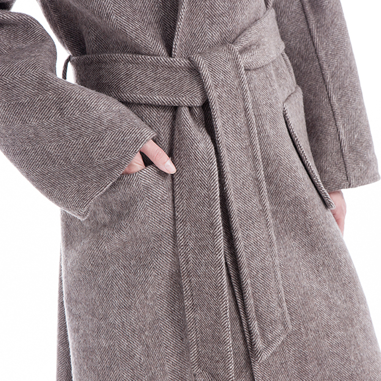 The upper end of a cashmere jacket with a belt for women in winter