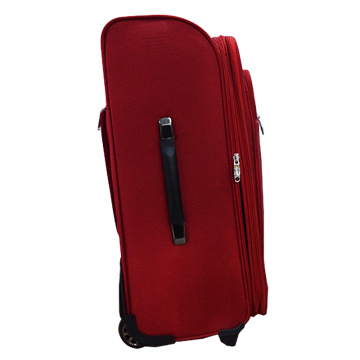 Red expandable spinner luggage for travel