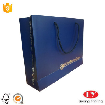 Blue paper gift bag with silver foil logo