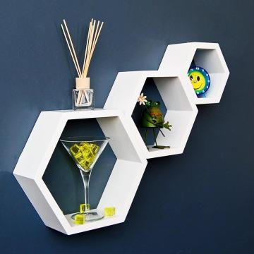 Decorative shelves on hexagonal wooden wall
