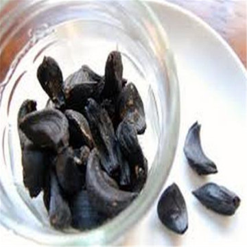 a Healthy Food with peeled Black Garlic
