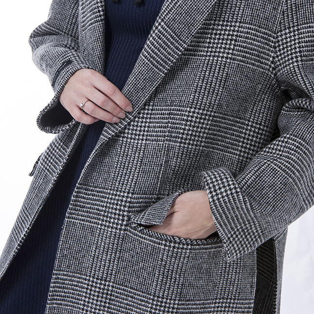 Sleeves of grey striped cashmere winter coat
