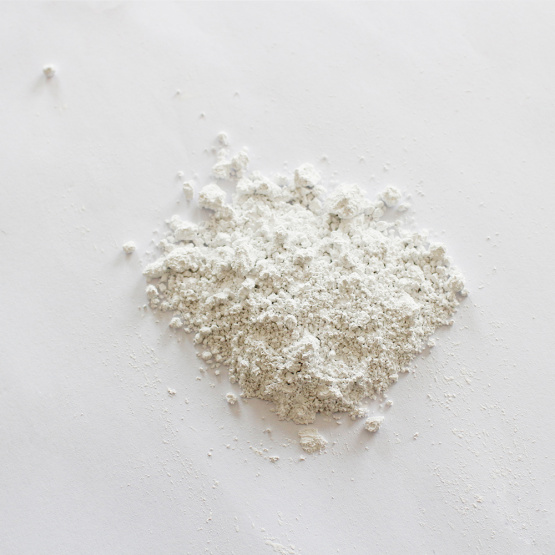 Odorless calcium carbonate carrier additive