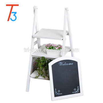 white freestanding wooden chalkboard easel with 3 display shelves