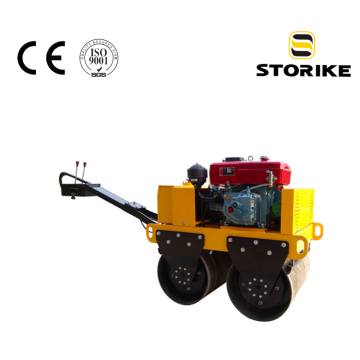Hand-held small portable double drum road roller