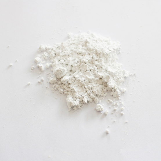 Radiation-free calcium carbonate carrier additive