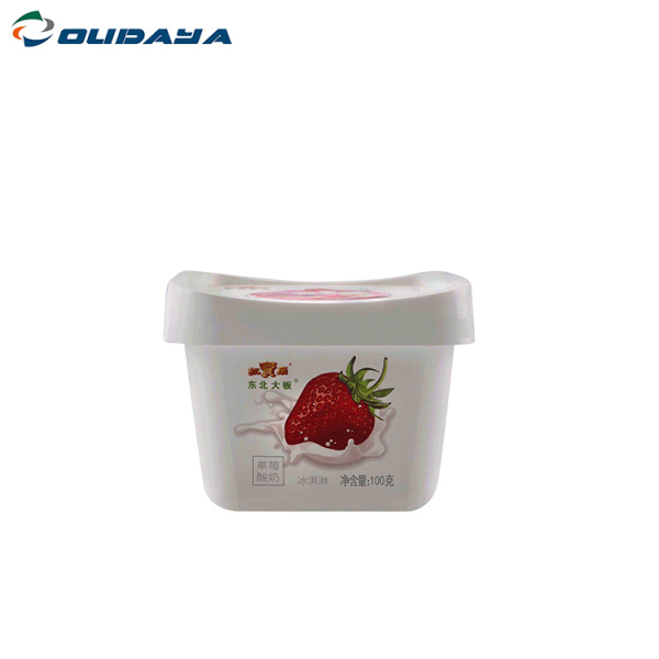 square yogurt cup with lid and spoon