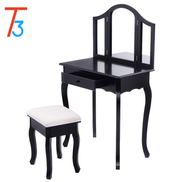 Bedroom with black dressing table with mirror and stool