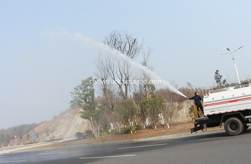 water spray truck  in action 4