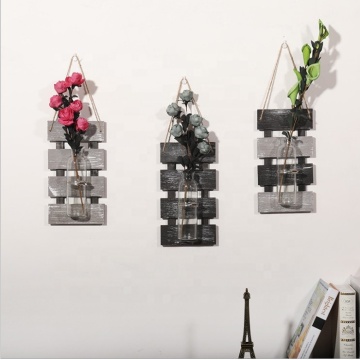 Decorative hanging wood shelf with glass vase