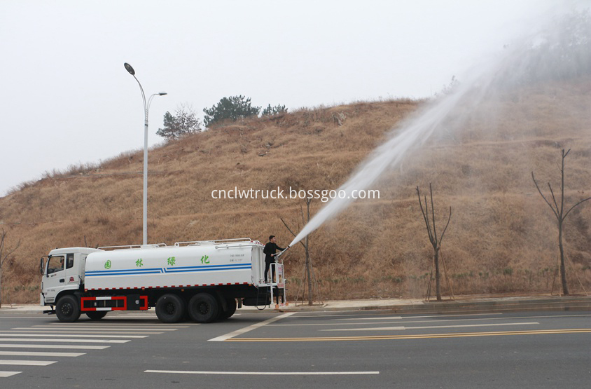 street water spray truck  in action 4