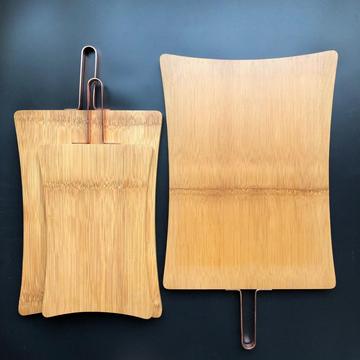 Bamboo cutting board with metal handle