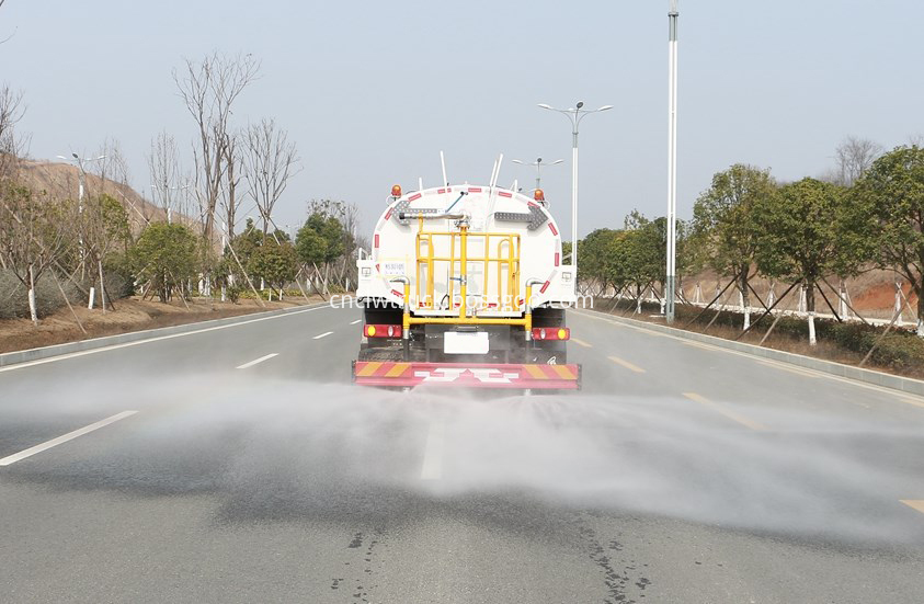 water spray truck  in action 2